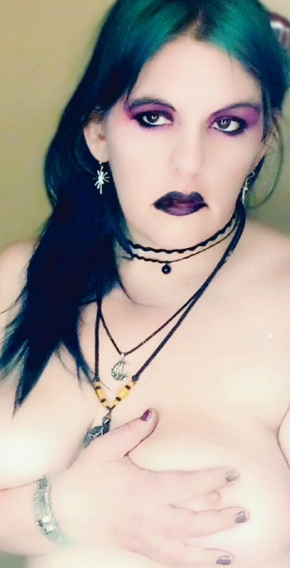 Dark lips, flowing green hair
